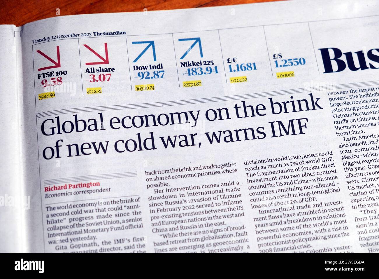 'Global economy on the brink of new cold war, warns IMF' Guardian newspaper headline financial news article 12 December 2023 London UK Great Britain Stock Photo