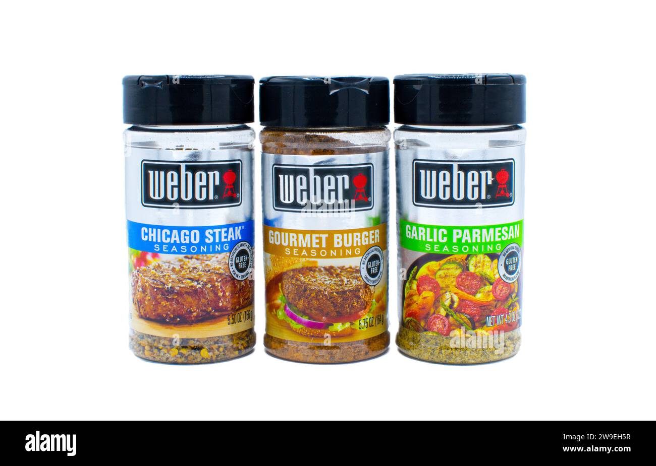 Weber brand seasoning rub for meat, beef, fish, pork and vegetable.  Three containers Chicago steak, gourmet burger, garlic Parmesan cheese.  Isolated Stock Photo