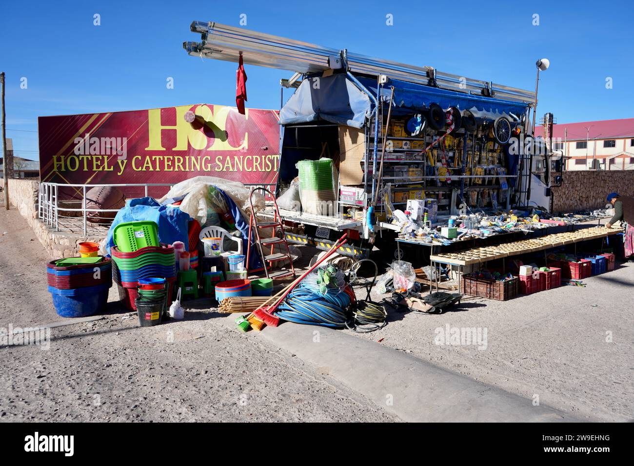 Roadside Hardware Market Stall under a blue sky. San Cristóbal, Bolivia. Stock Photo