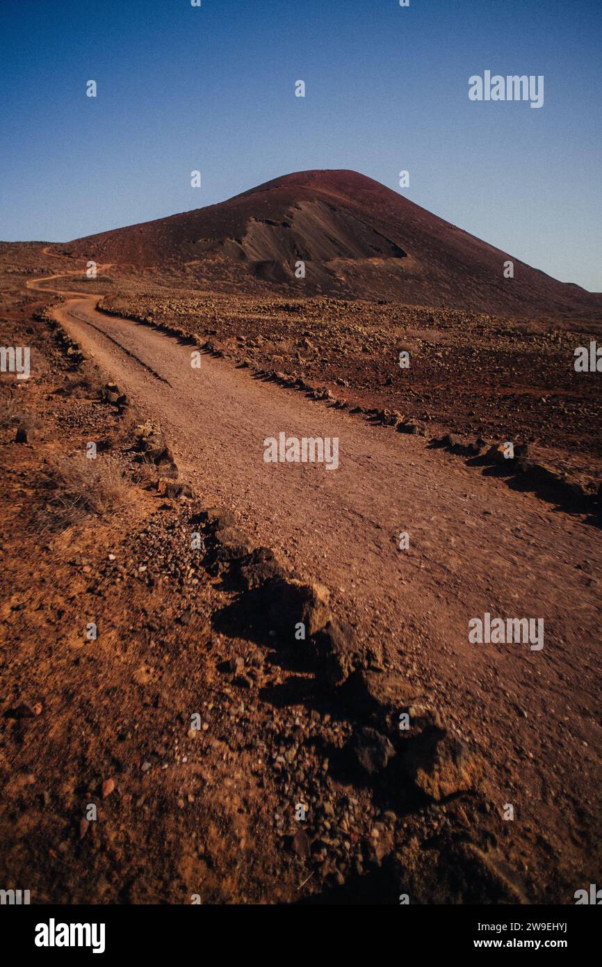 A hiking, rocky path onto a small volcano Stock Photo