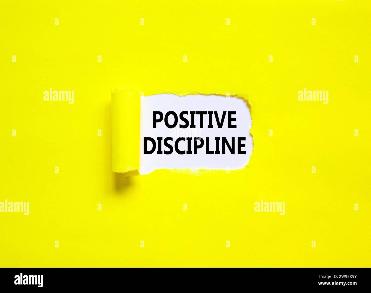 Positive discipline symbol. Concept words Positive discipline on beautiful white paper. Beautiful yellow paper background. Business psychology positiv Stock Photo