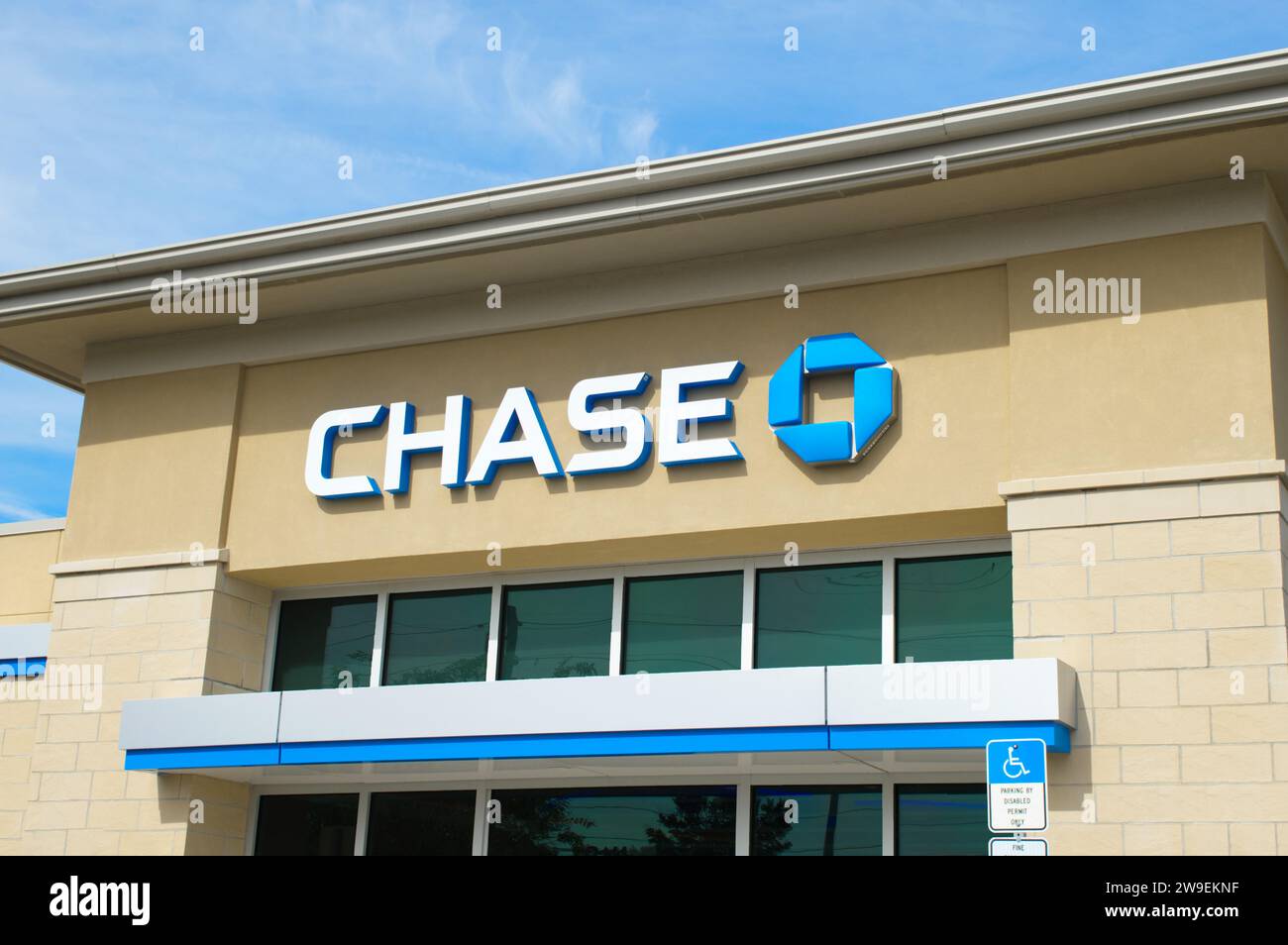 October 14, 2023 Ocala, Florida local branch of Chase Manhattan bank store front sign in blue and white colors with blue sky background.  four parts o Stock Photo