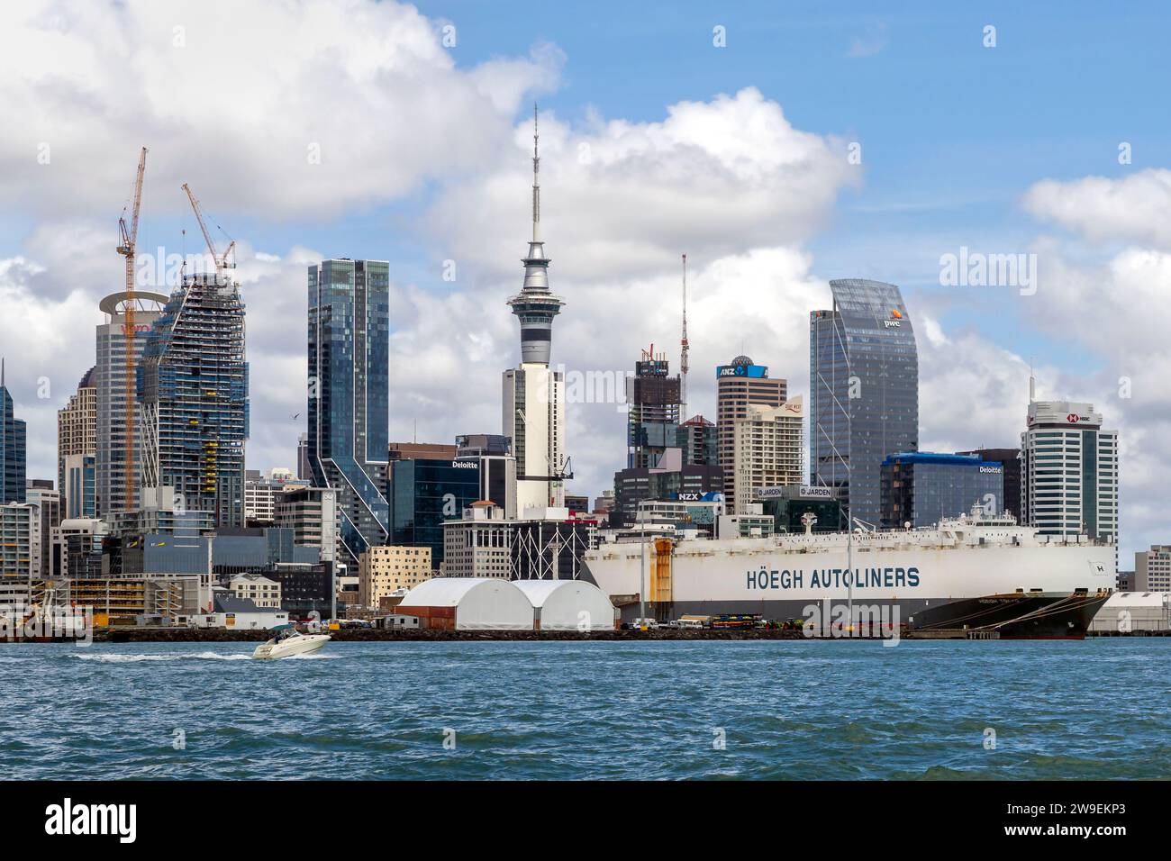 Höegh Autoliners cargo ship and the skyline of the port city Tāmaki Makaurau (Auckland), Te Ika