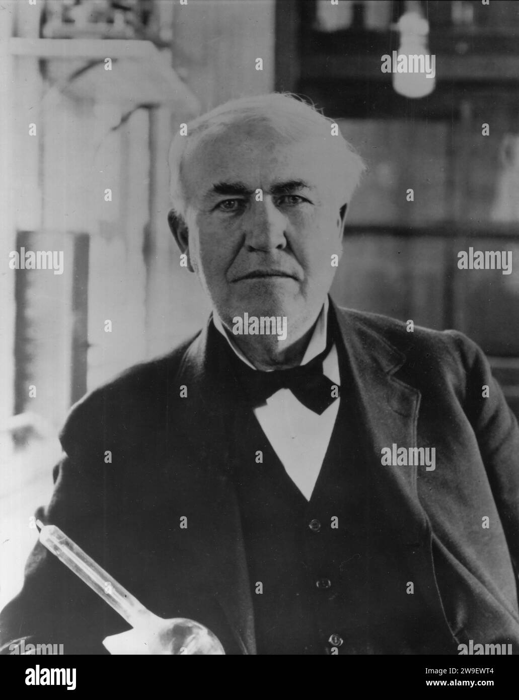 Thomas Edison in lab with "Edison Effect" bulbs. Year 1919. Location
