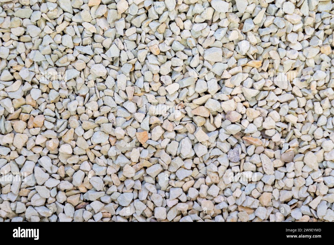 Finely ground zeolite mineral stones. A spread of small pebble-like fragments. Stock Photo