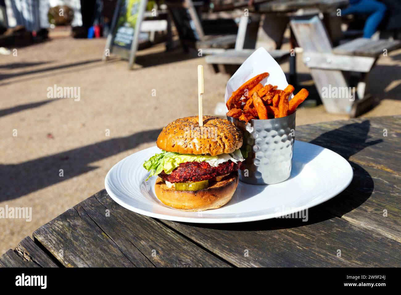 Plant burger with sweet potato fries at Queen Victoria pub, Theydon Bois, Essex, England Stock Photo