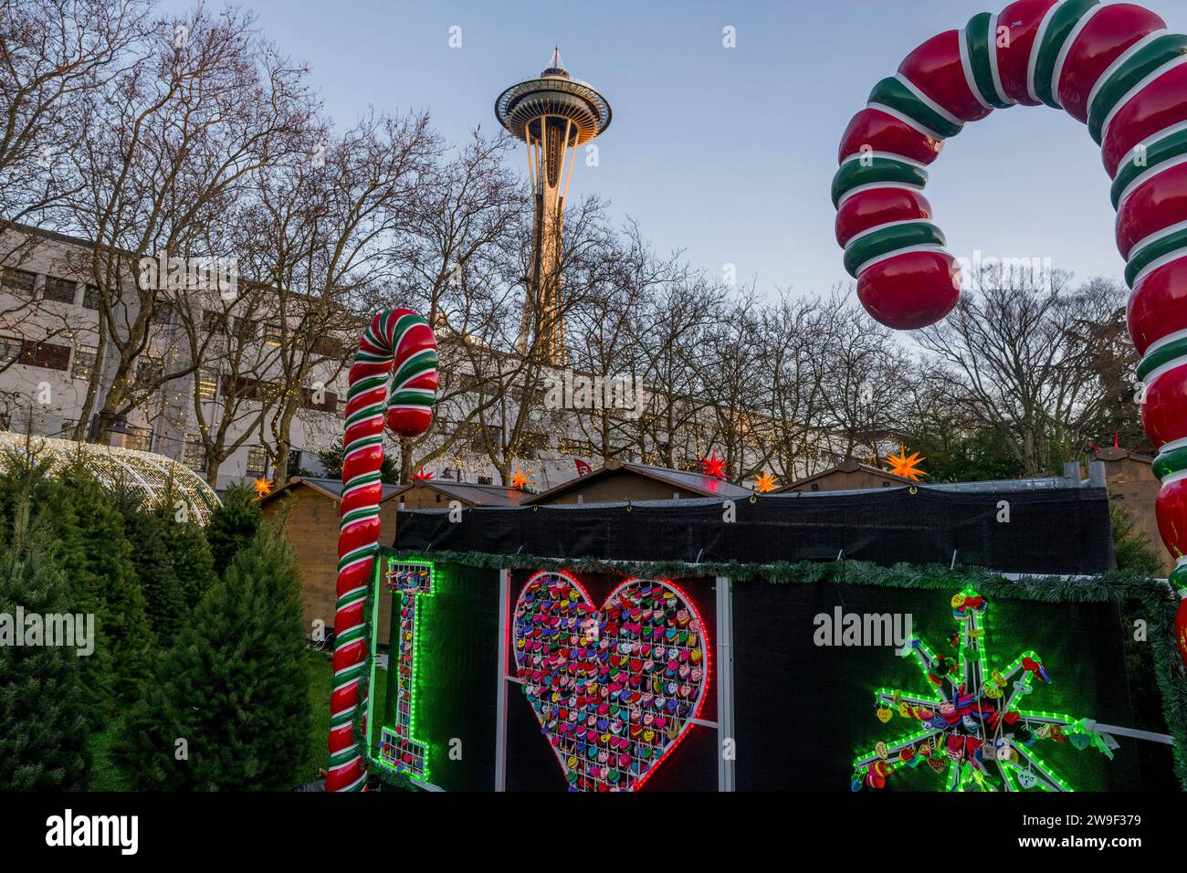 Seattle Christmas Market scene with holiday lights, sugar canes, Love Locks, and the Space