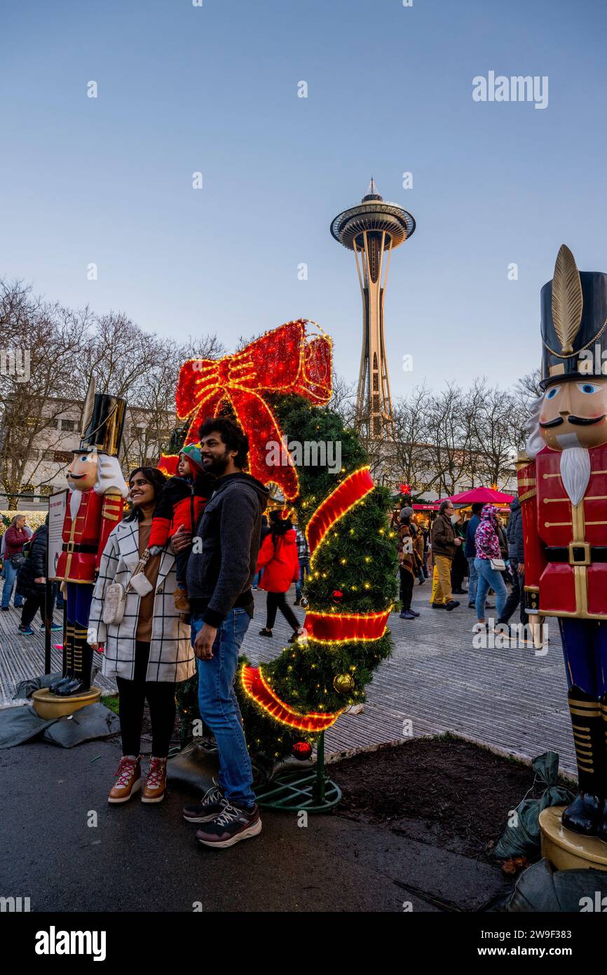 Seattle Christmas Market scene with holiday lights, nutcracker statues, and the Space Needle at