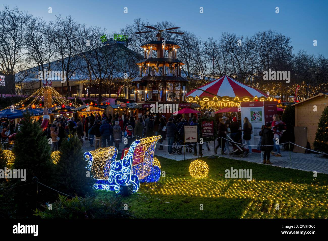 Seattle Christmas Market scene with the Christmas Pyramid, Santa s sleigh, holiday lights, and