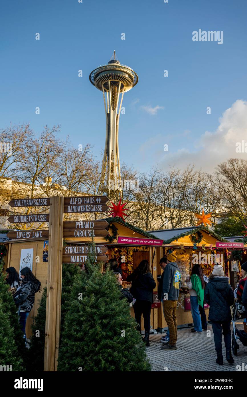 Seattle Christmas Market scene with vendors and the Space Needle at the Seattle Center in