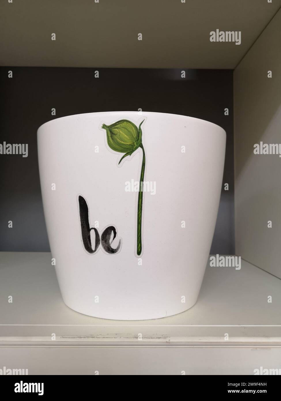 A white ceramic bowl is visible on a shelf Stock Photo