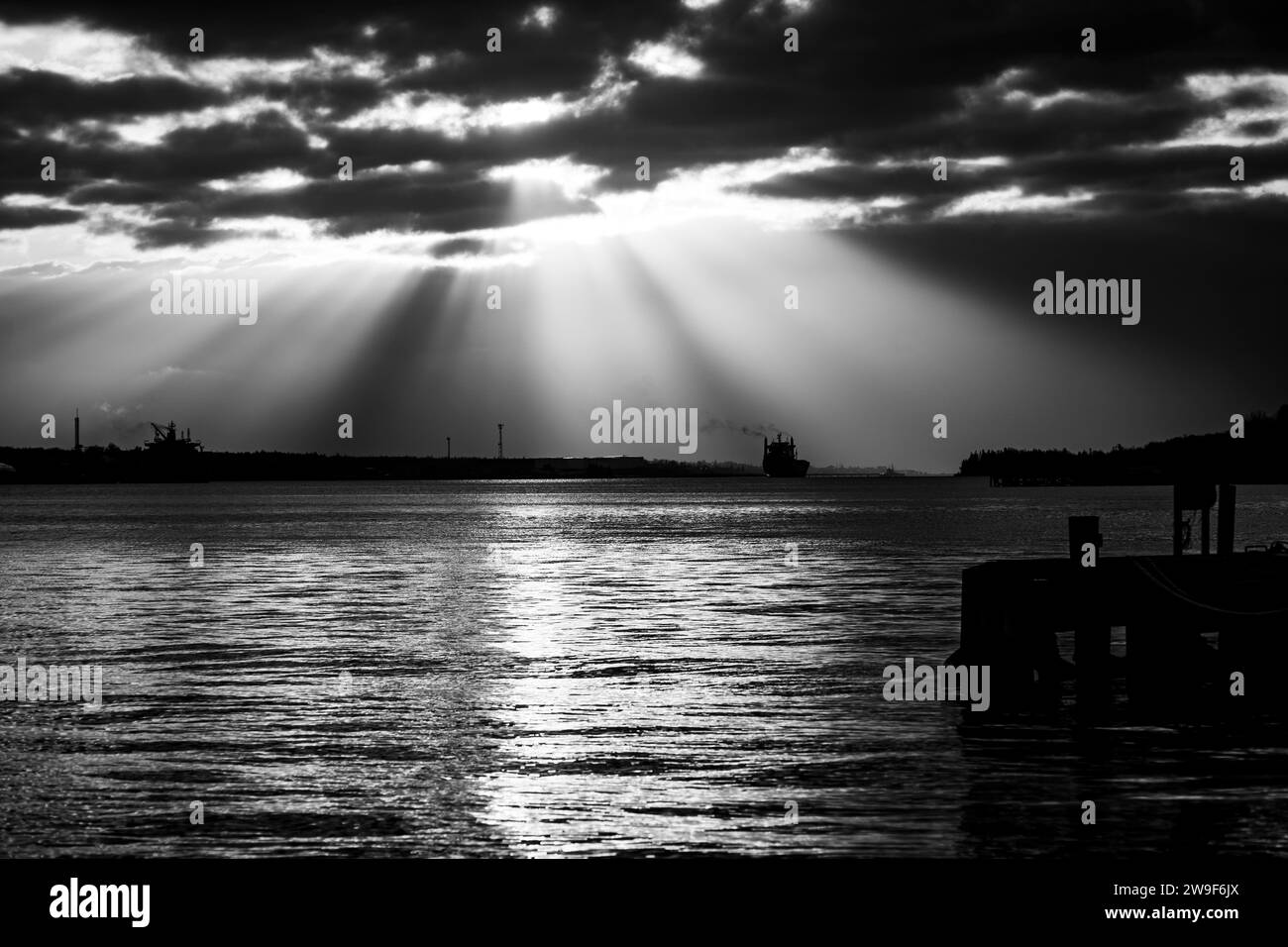Clouds with light fingers Black and White Stock Photos & Images - Alamy