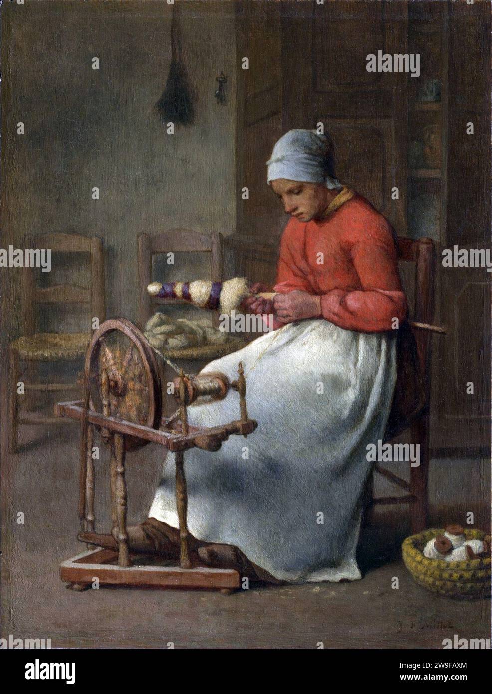 Woman Spinning (The Spinning Wheel), 1855-60. Painting by Jean-François Millet Stock Photo