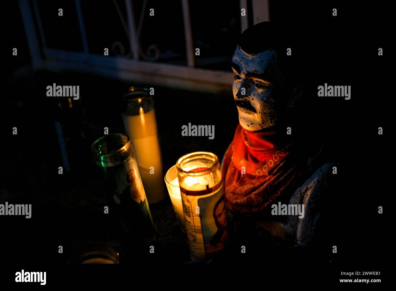 Jesús Malverde and candle holder in the vigina in oven on the day of