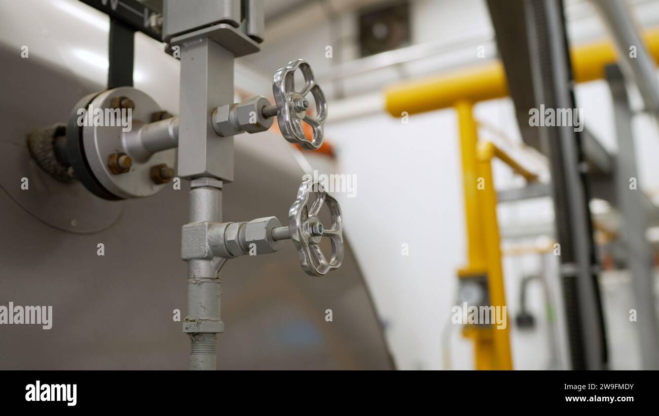 As boiler room, boilers and equipment. Faucet for water supply in a