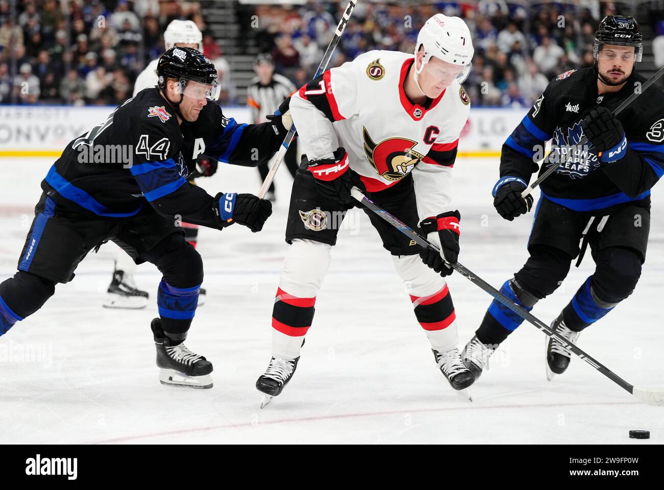 Ottawa Senators' Brady Tkachuk (7) protects the puck from Toronto Maple ...