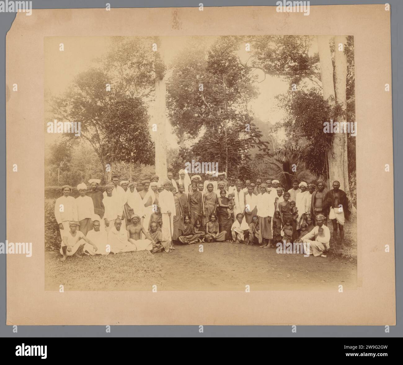 Group portrait of Indian contract workers on a tobacco plantation, Dutch East Indies, 1891 - 1894 photograph  Dutch East Indies, The paper. cardboard albumen print working class, labourers. plantation. anonymous historical persons portrayed in a group, in a group-portrait Sumatra Stock Photo