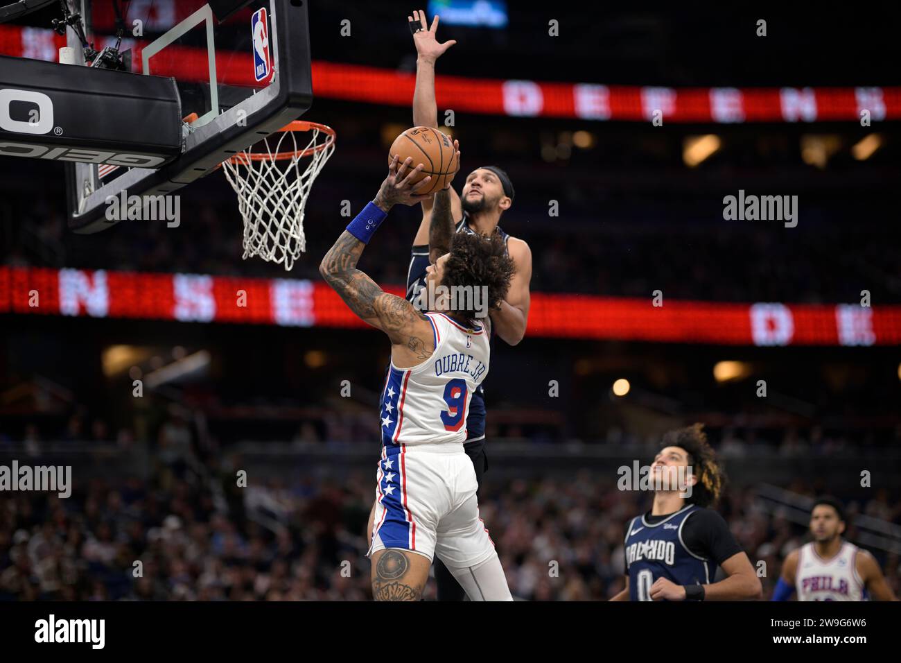 Philadelphia 76ers guard Kelly Oubre Jr. (9) is fouled by Orlando Magic ...