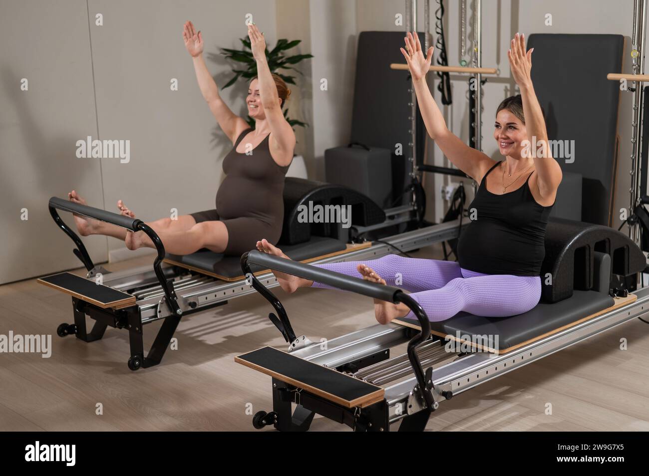 Attractive girl practicing pilates on hi-res stock photography and