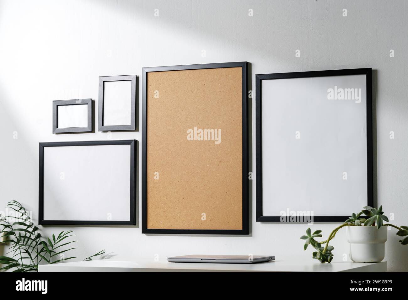 Set of black frames on white wall with copy space Stock Photo