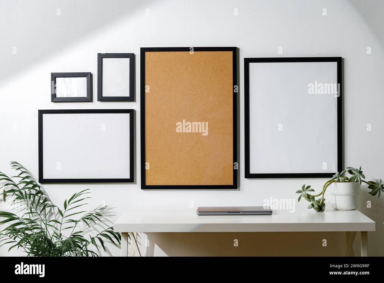 Set of black frames on white wall with copy space Stock Photo