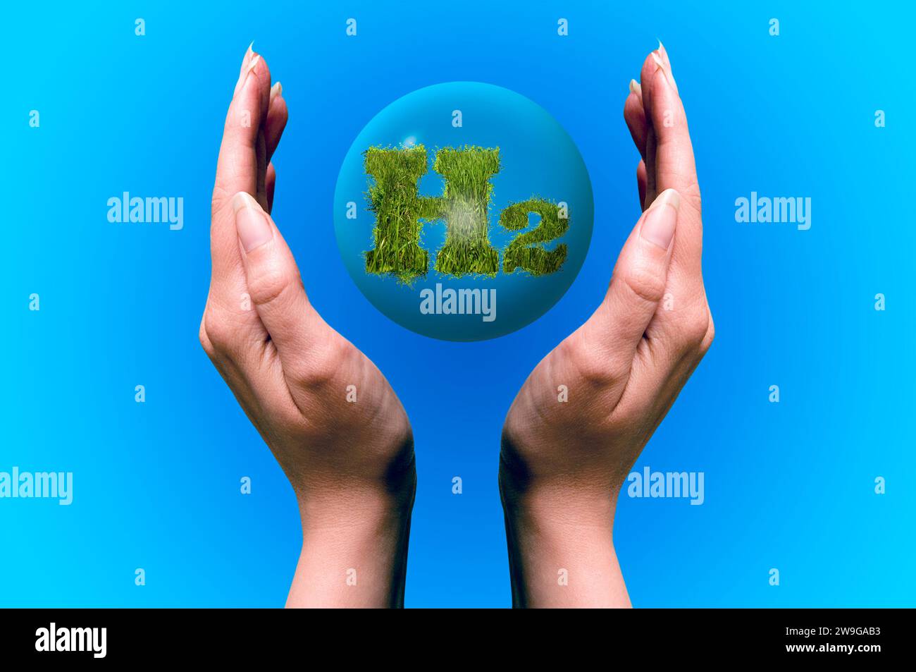 hands holding a sphere with H2 chemical formula  for hydrogen Stock Photo