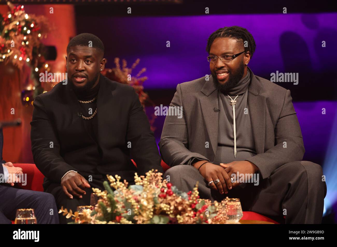 EDITORIAL USE ONLY Femi Koleoso (left) and TJ Koleoso, of Ezra Collective during the filming for the Graham Norton Show at BBC Studioworks 6 Television Centre, Wood Lane, London, to be aired on BBC One on Sunday evening. Picture date: Wednesday December 13, 2023. Photo credit: Isabel Infantes/PA Wire Stock Photo
