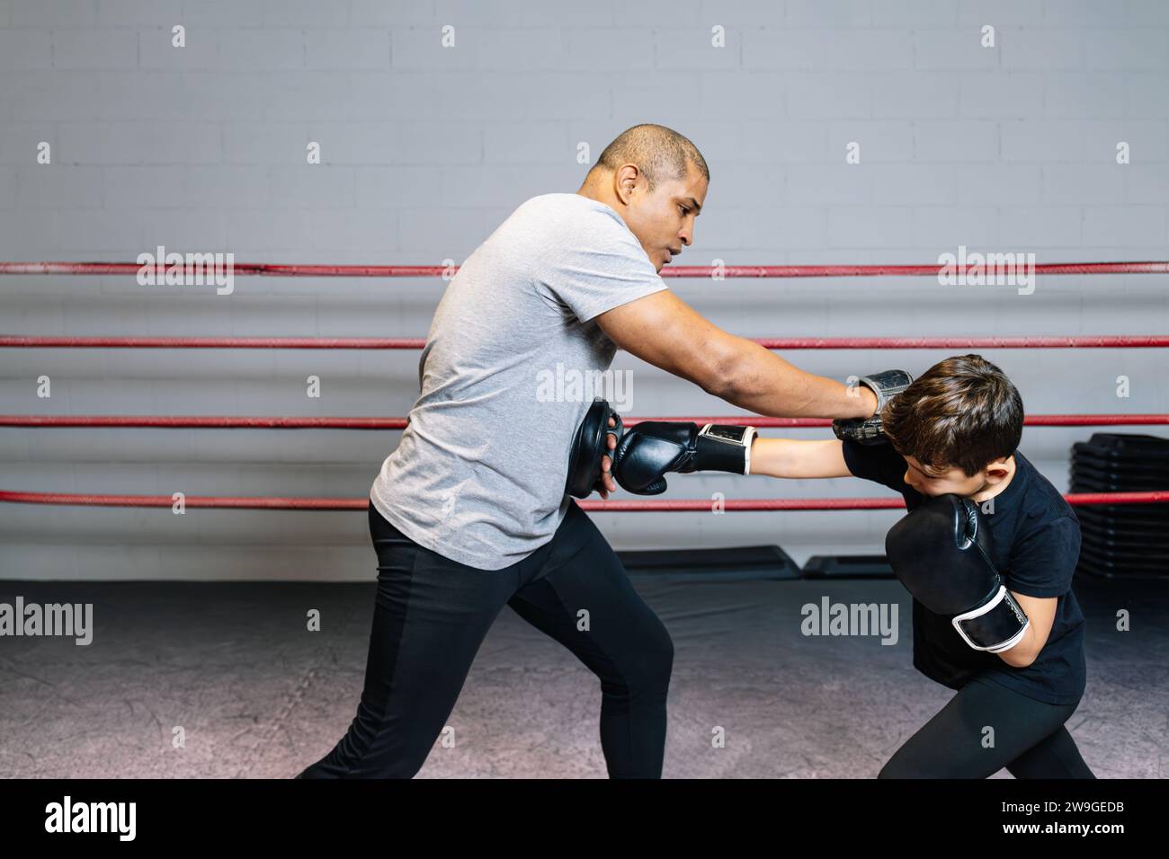 Horizontal photo elementary boy, dressed in tights, tshirt and black