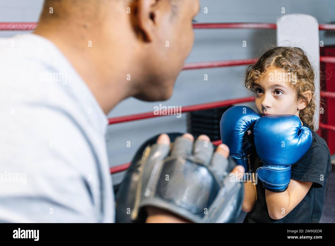 Horizontal photo elementary girl, dressed in black tshirt and blue