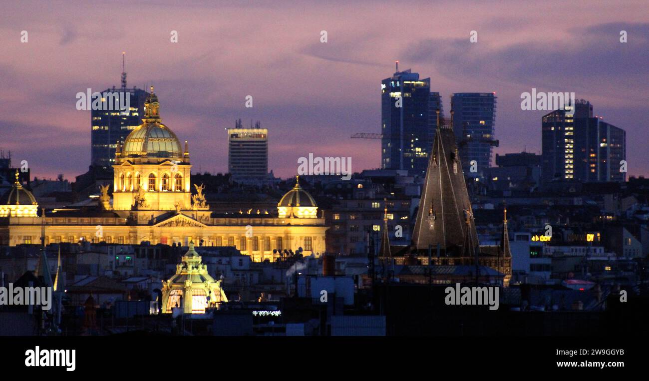 Golden dome of the roof of the National Museum in Prague, in the background skyscrapers in Pankrac, in the foreground Powder Tower, night image, Pragu Stock Photo