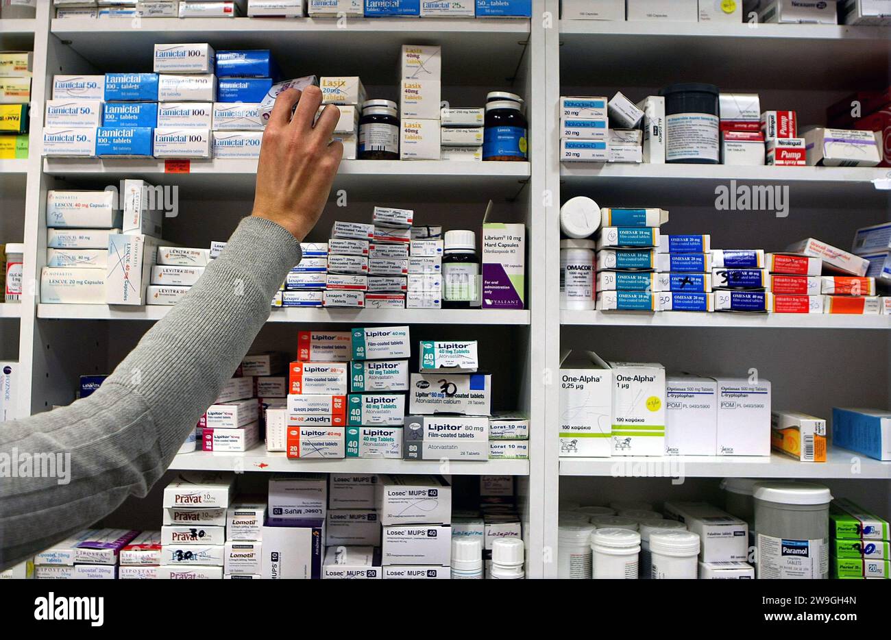 File photo dated 16/11/09 of a pharmacist stocks shelves at a chemist. Emergency contraception became available over the counter in Northern Ireland for the first time following a commercial application. A previously secret state file on emergency contraception includes a briefing note, as the morning-after pill became available over the counter in 2001. Issue date: Thursday December 28, 2023. Stock Photo