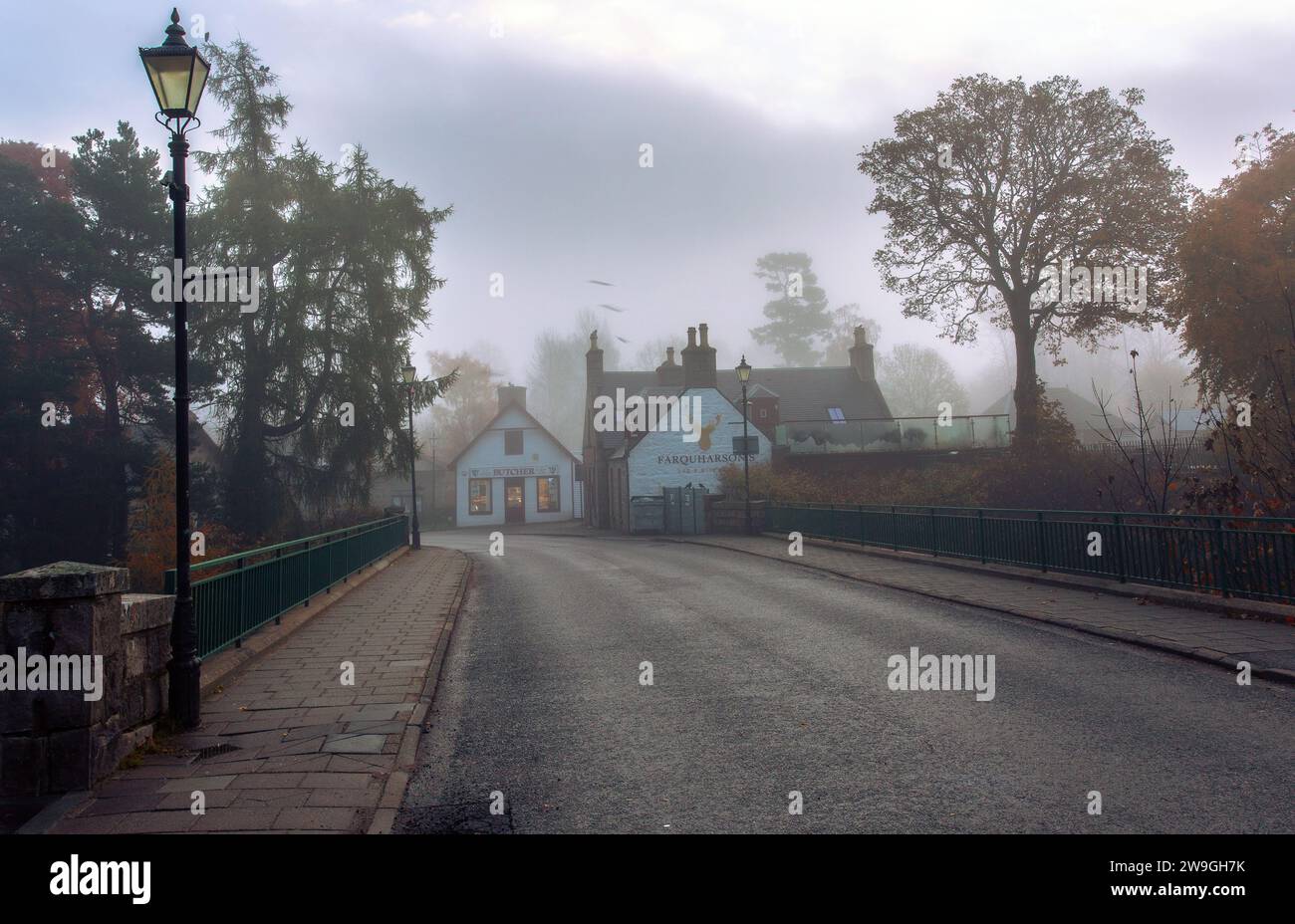 Braemar bridge : village street scene early morning with fog ,Scotland . Stock Photo