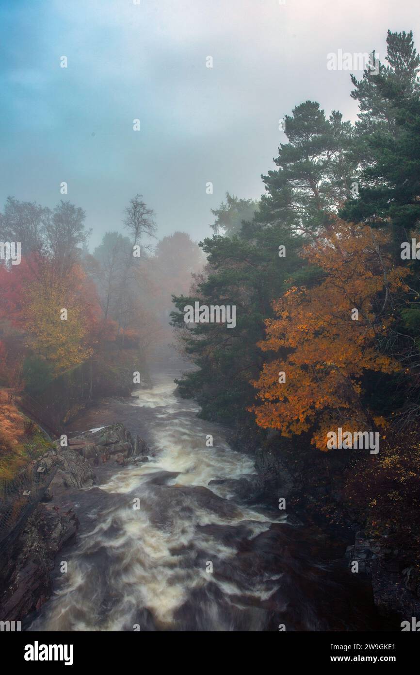 Misty morning in Braemar with lovely view of the lively Clunie Water tumbling over the rocks, Scotland . Stock Photo
