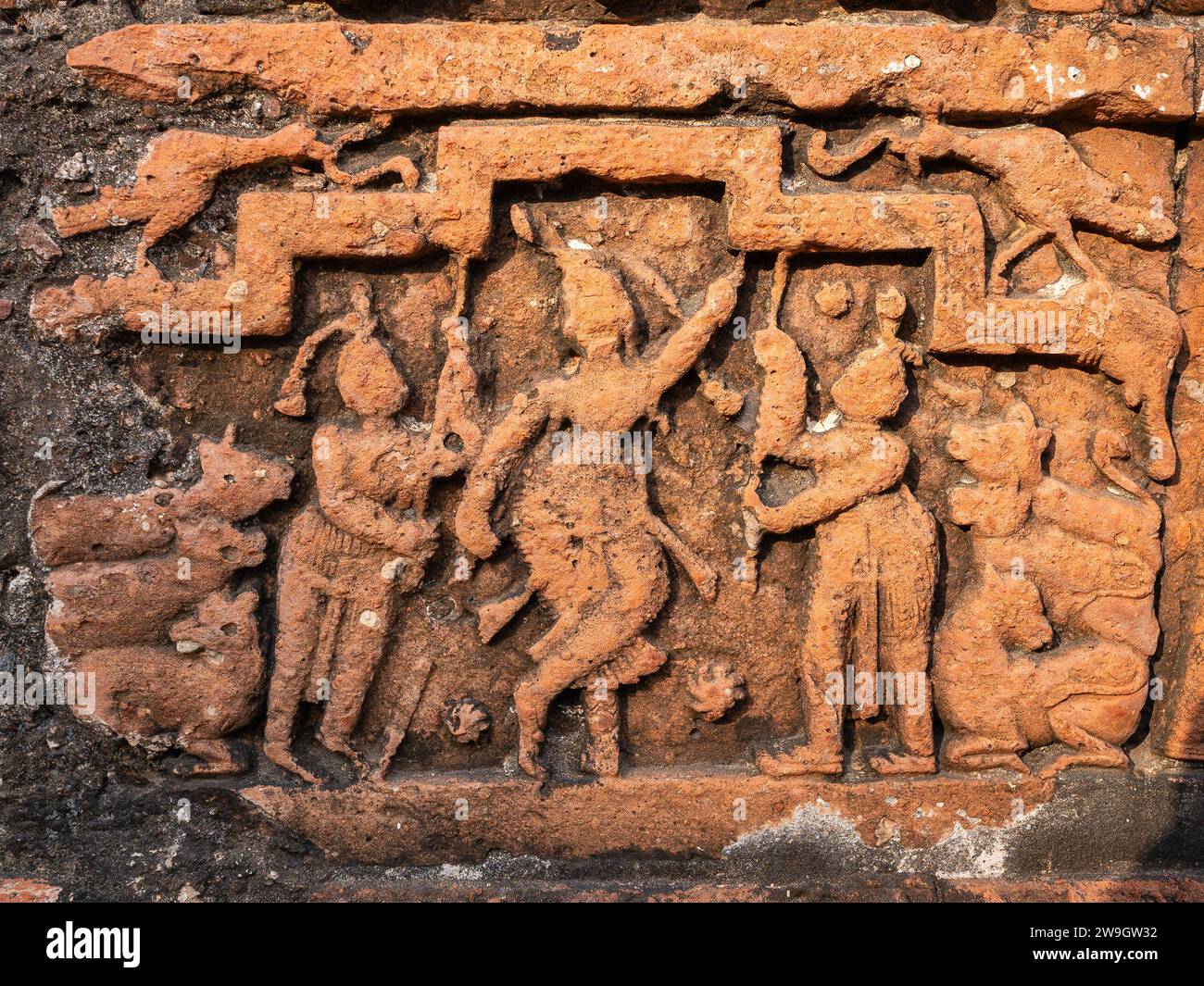 Detail of ancient terracotta relief depicting Krishna Govardhana hindi legend on exterior wall of Chauchala Chhota Govinda temple, Puthia, Bangladesh Stock Photo