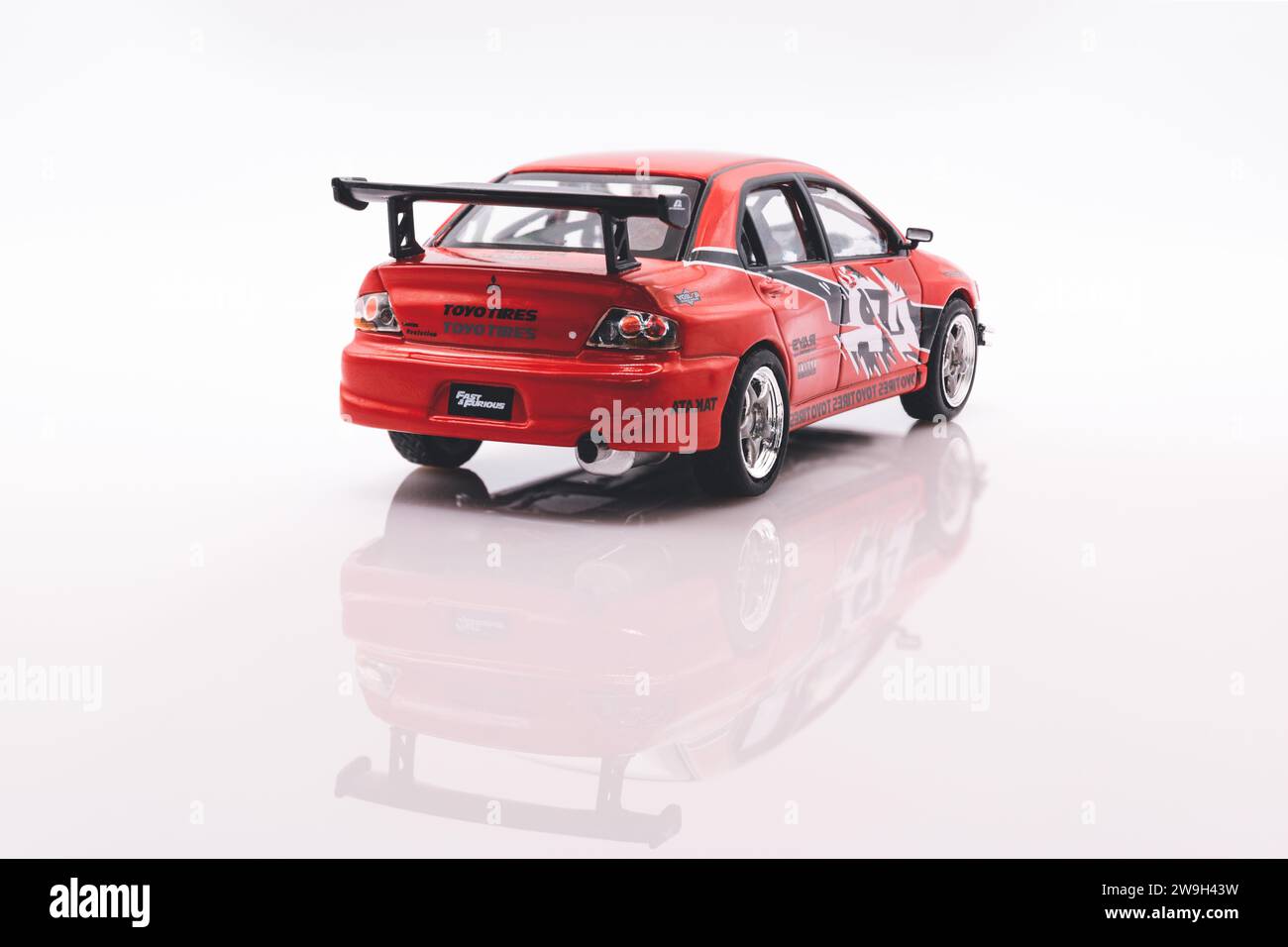 Fast&Furious Mitsubishi Lancer EVO 8 1:43 model car, rear view, white background with reflection Stock Photo