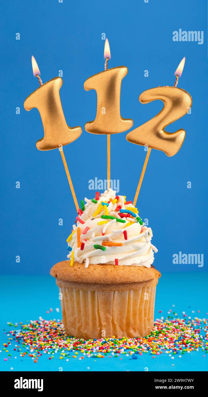 Birthday cake with candle number 112 - Blue background Stock Photo - Alamy