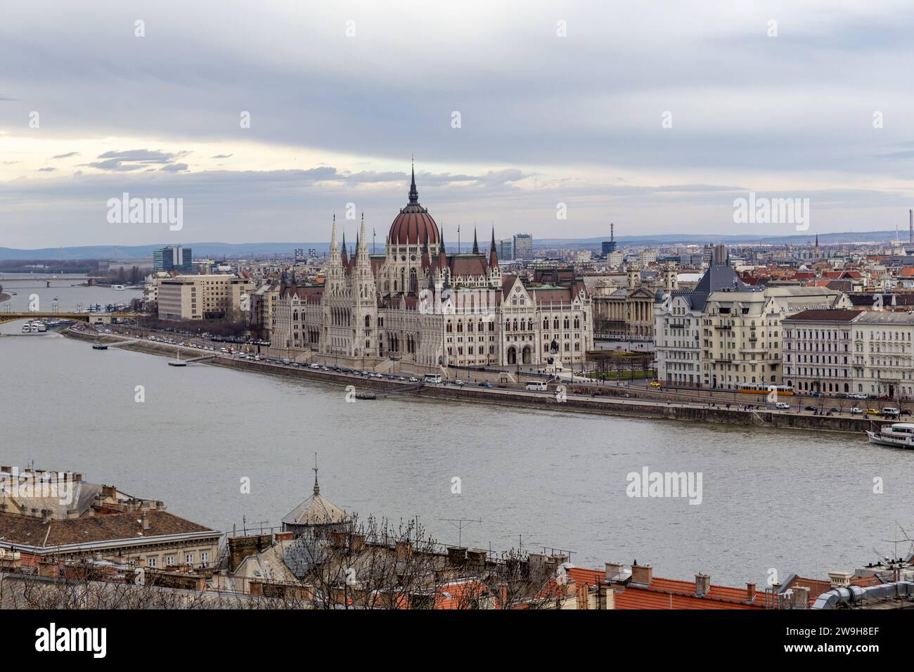 BUDAPEST, HUNGARY - MARTH 14, 2023: This is a view of the neo-Gothic building of the Hungarian Parliament from the heights of Buda Hill. Stock Photo