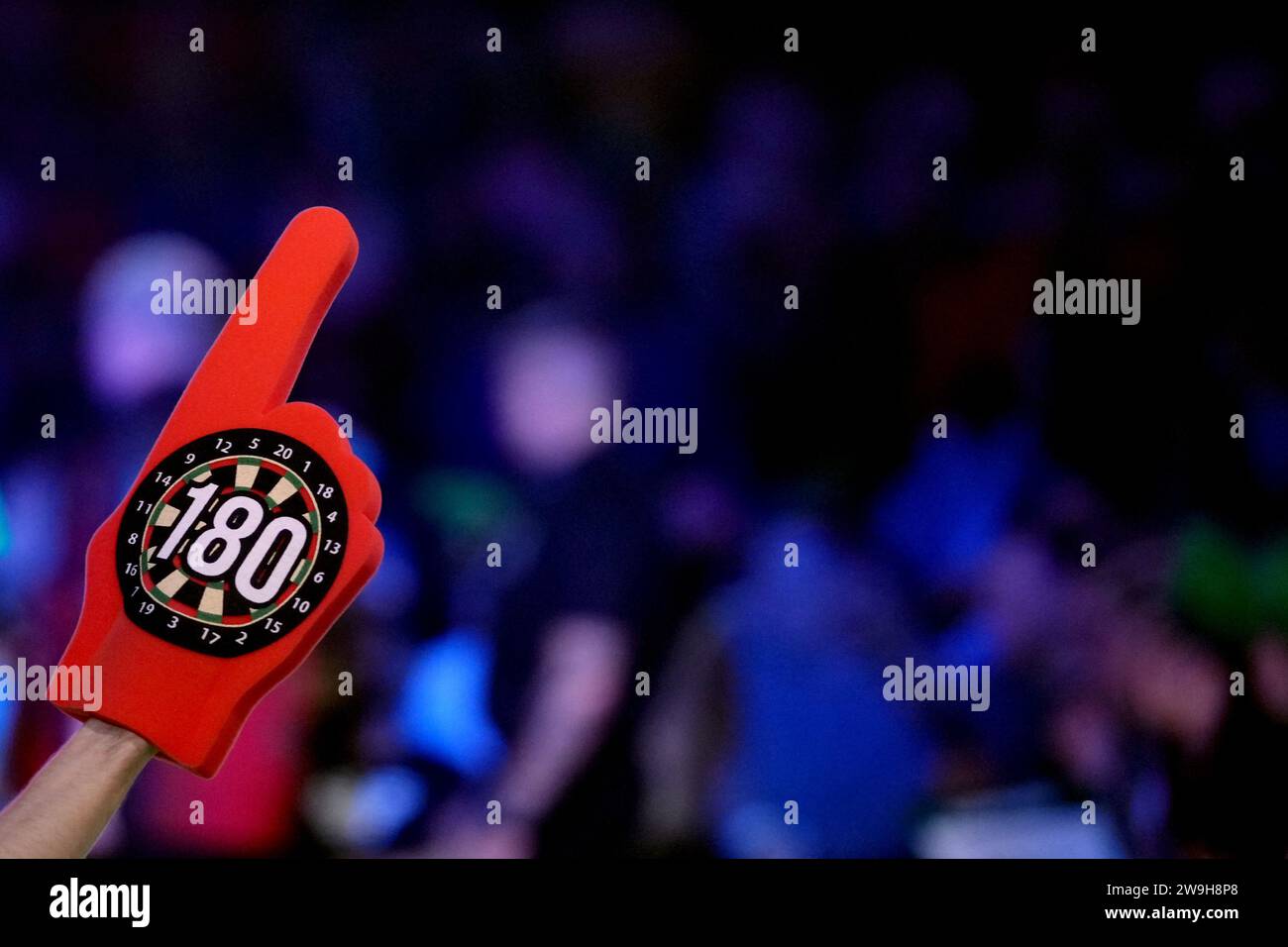 A darts fan with a darts themed foam finger on day eleven of the Paddy Power World Darts