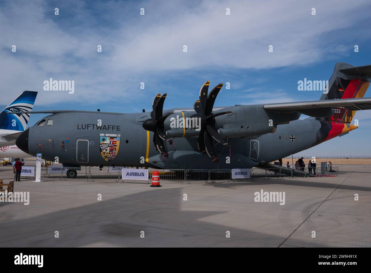 An airbus A400 from the german Luftwaffe with the Air Defender 2023 special markning, german flag on the tail, at an airshow in Dubai. Hazy blue sky. Stock Photo