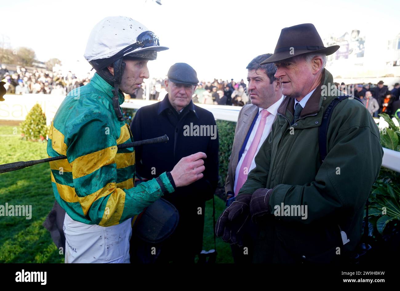 Winning jockey Mark Walsh (left), owner J. P. McManus and trainer Willie Mullins (right) after Fact To File won the Ballymaloe Relish Rising Stars Beginners Chase during day three of the Leopardstown Christmas Festival at Leopardstown Racecourse, Dublin. Picture date: Thursday December 28, 2023. Stock Photo