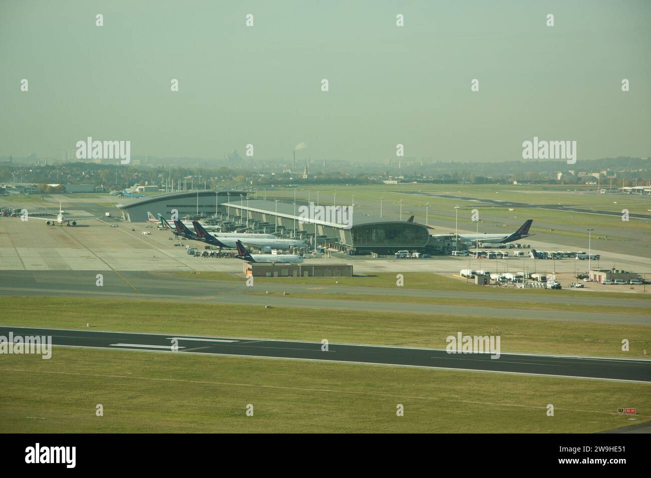 Airplanes on tarmac under sunset Stock Photo - Alamy