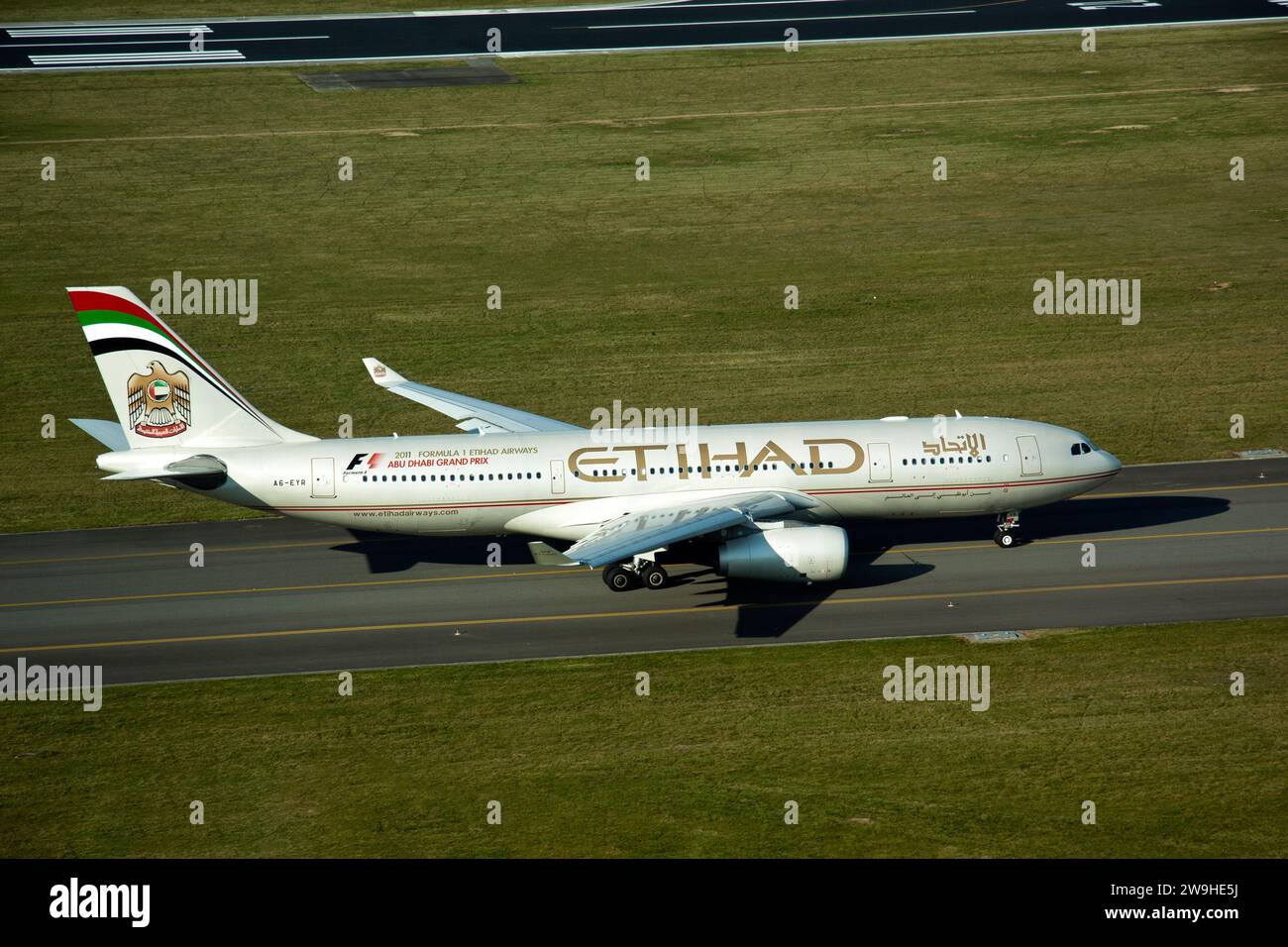 Airplanes on tarmac under sunset Stock Photo - Alamy