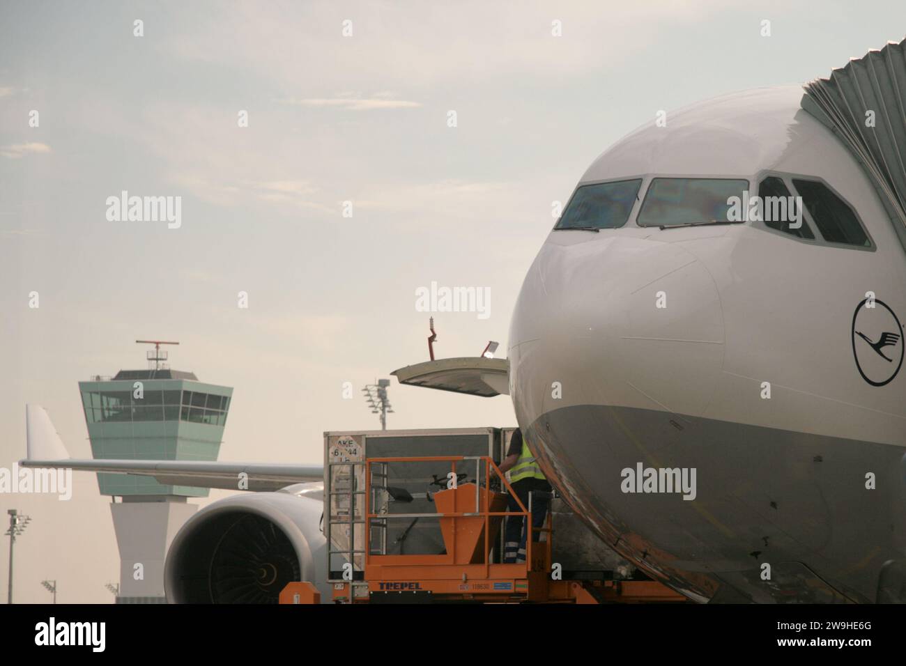 Airplanes on tarmac under sunset Stock Photo - Alamy