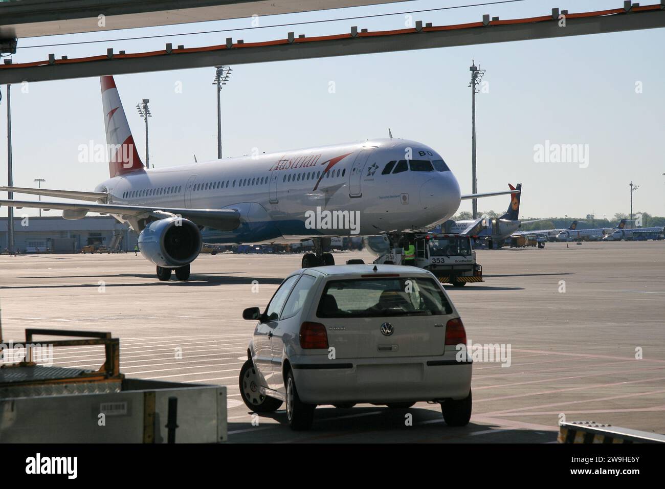 Airplanes on tarmac under sunset Stock Photo - Alamy