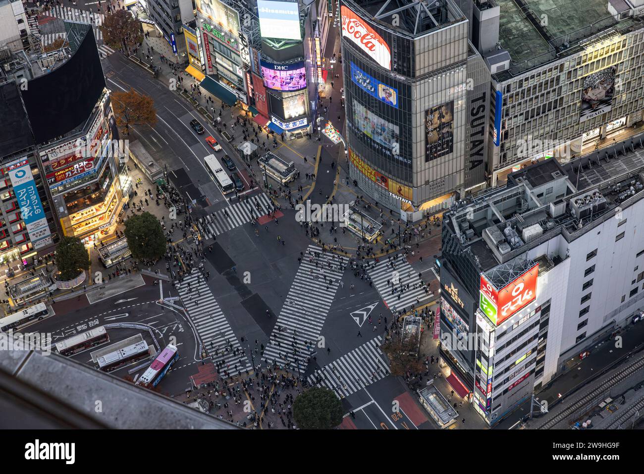 TOKYO/JAPAN - November 22, crowds of people prepare to cross the famous Shibuya Crossing aerial view Stock Photo