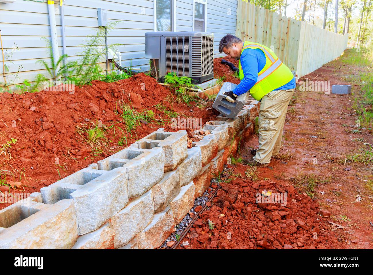 During Installation Of New Large Block Retaining Wall Contractor Was During installation of new large block retaining wall contractor was
