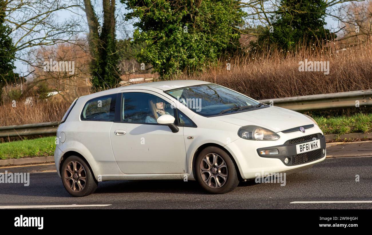Milton Keynes, UK - Dec 28th 2023:  2011 white Fiat Punto car driving on a British road Stock Photo