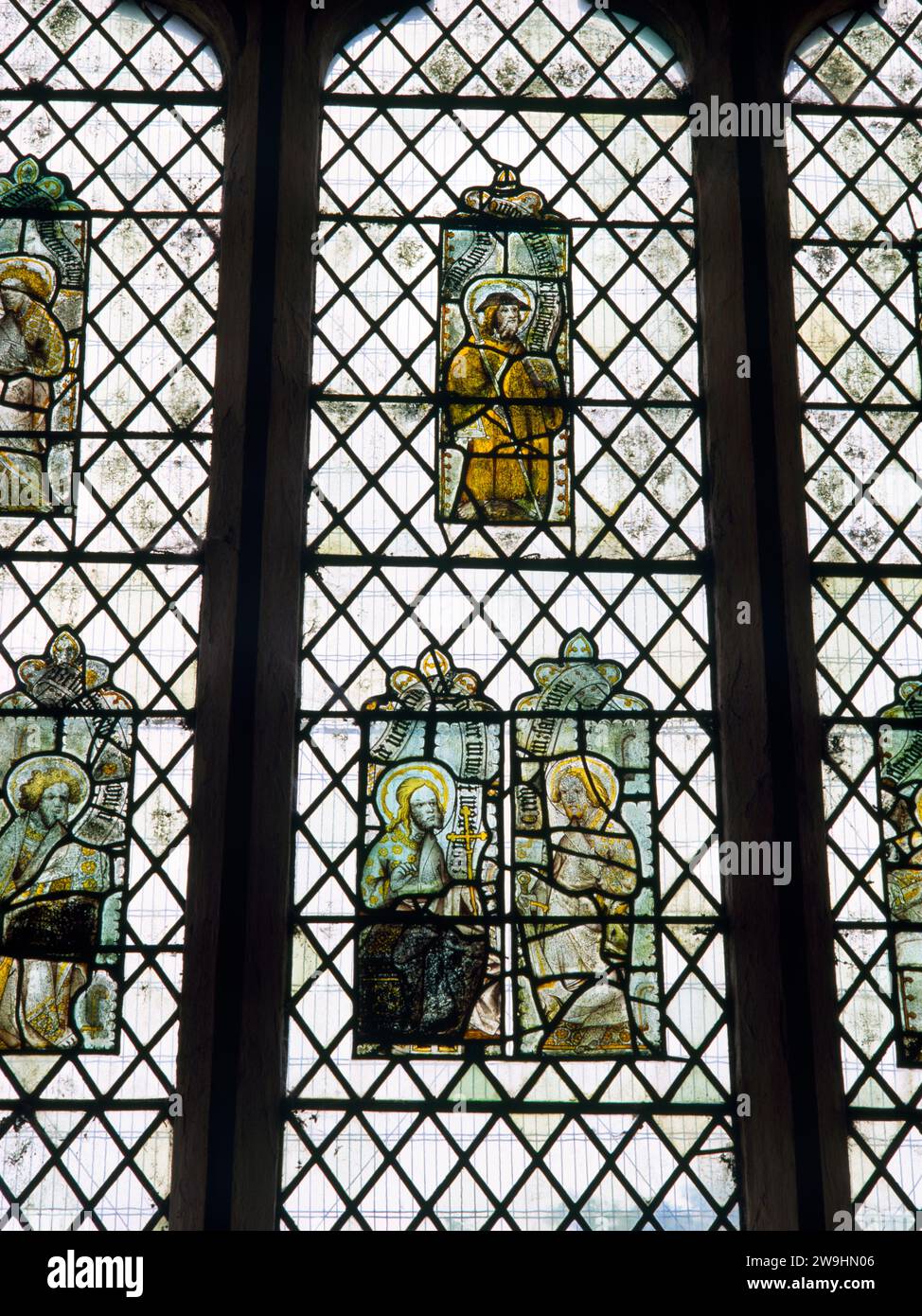 Medieval stained glass from Hailes Abbey placed in the E window of Hailes Church, Gloucestershire, England, UK: C15th depictions of apostles & saints. Stock Photo