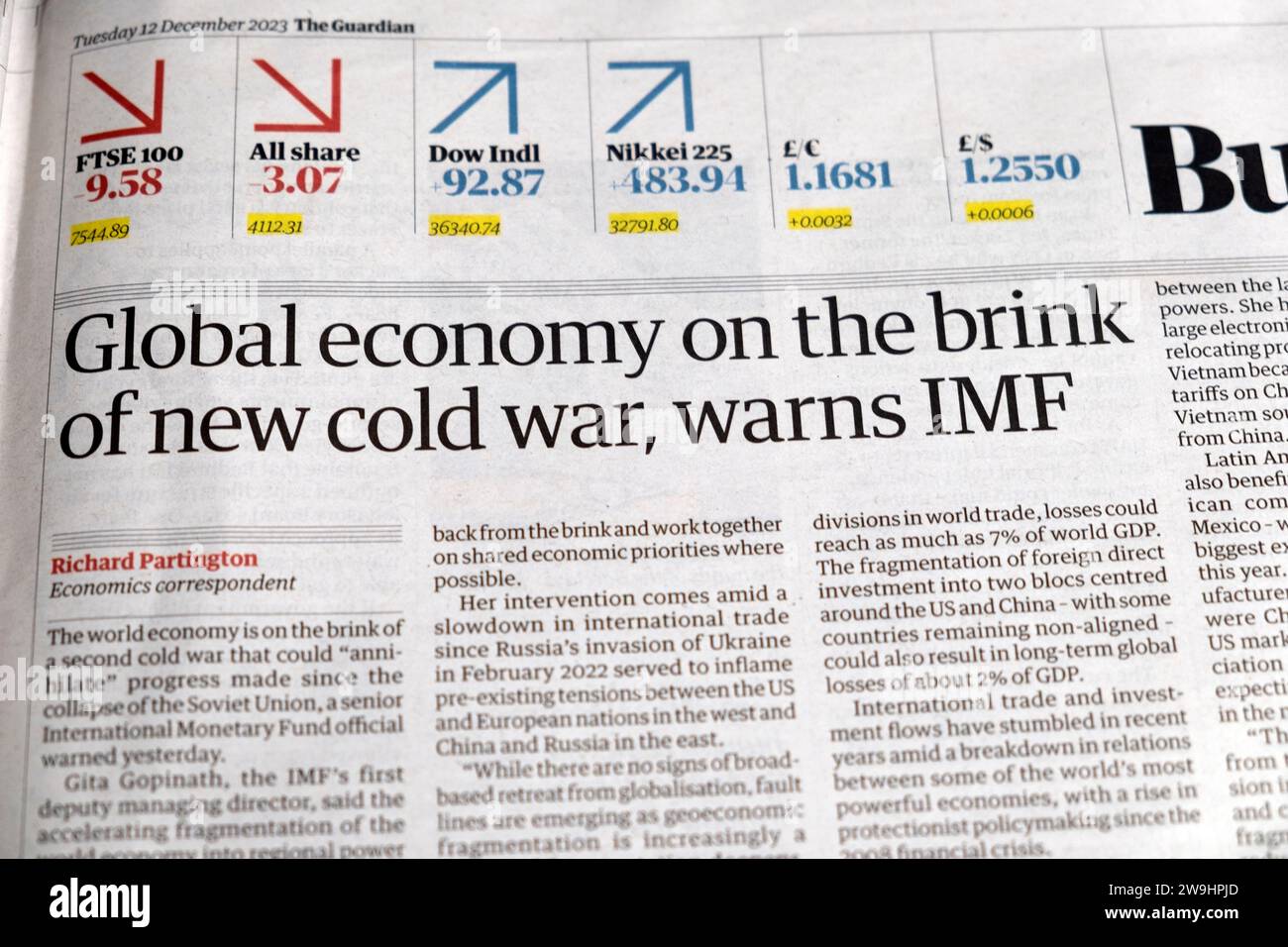 'Global economy on the brink of new cold war, warns IMF' Guardian newspaper headline financial news article 12 December 2023 London UK Great Britain Stock Photo