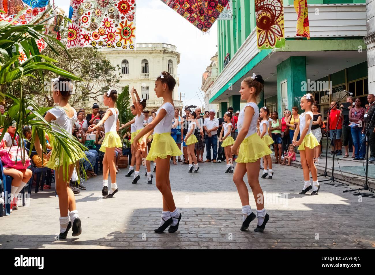 Cuban art students performing a ballet in front of a live audience at the Santa Clara Book Fair. Leoncio Vidal Plaza Stock Photo